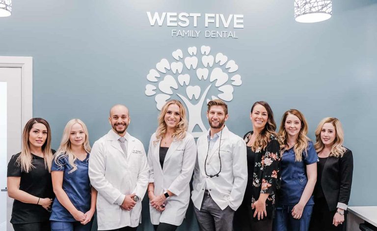 A group of 8 dentists and office staff in the West Five office.