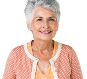 An elderly woman smiling.