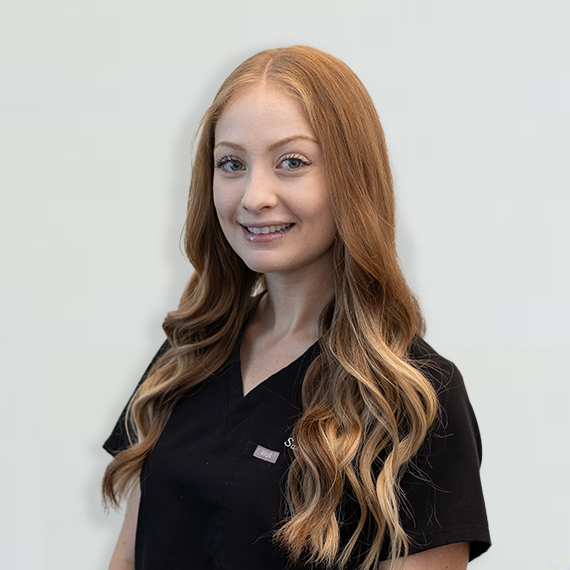 sarah-sq A photo of a woman smiling.